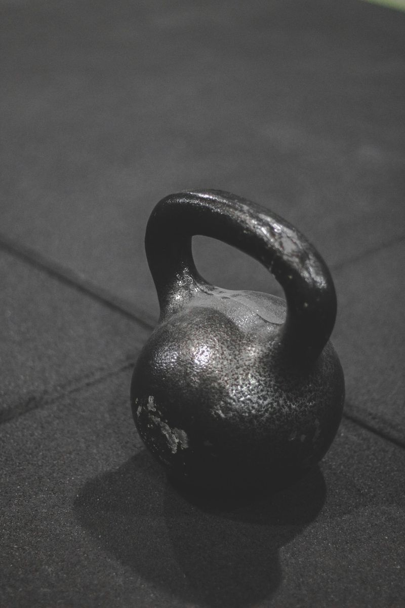 A single kettlebell on a gym floor